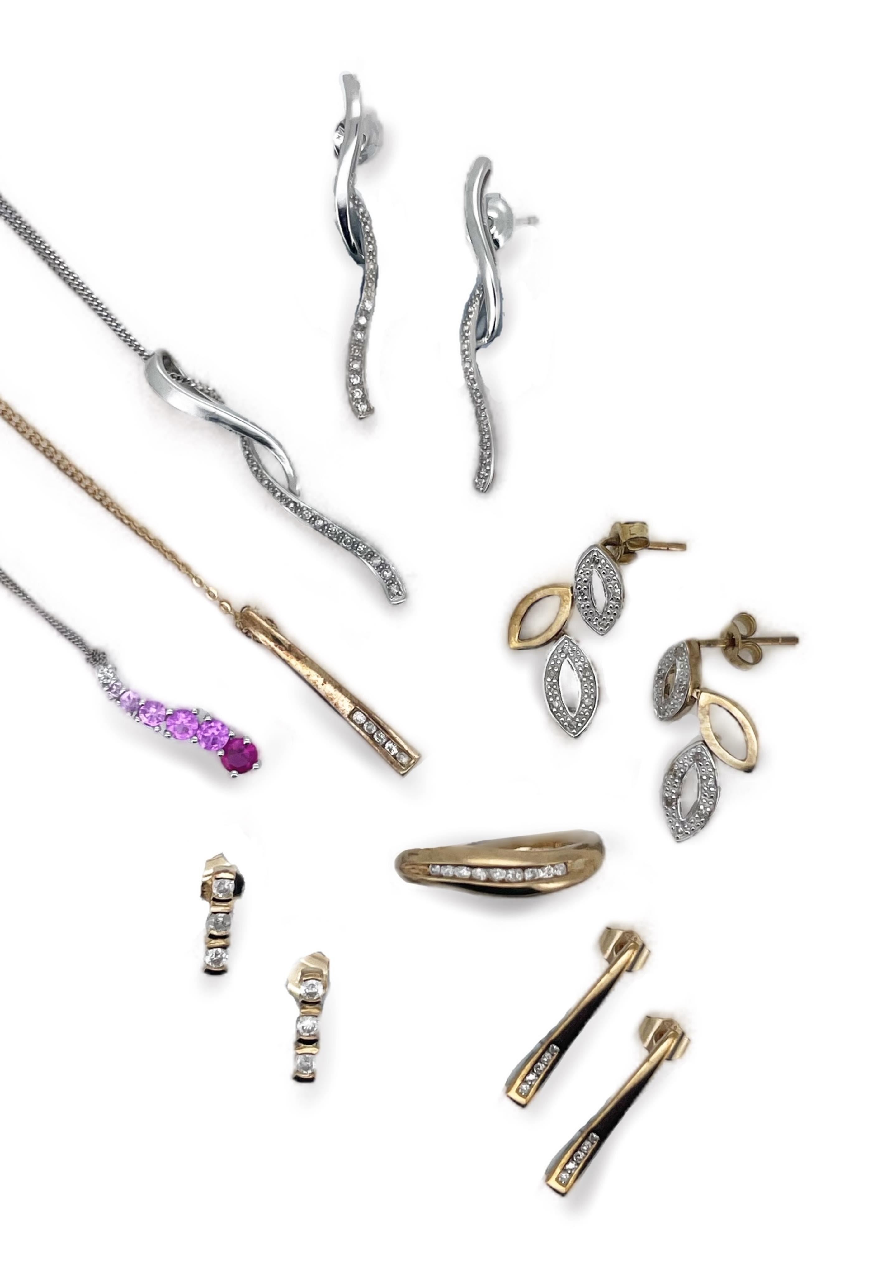 Two modern 375 white metal and gem set line pendants on 375 chains and one similar 375 yellow metal pendant on a 375 chain, four assorted pairs of modern 375 and gem set ear studs including diamond and a modern 9ct gold